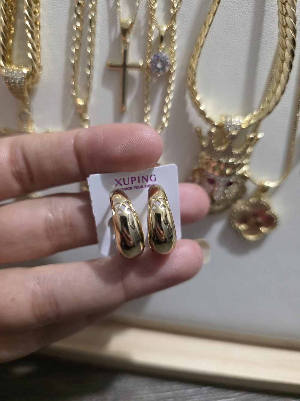 Ping Polished Gold Curved Huggie Earrings
